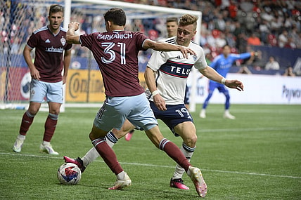 Apr 29, 2023; Vancouver, British Columbia, CAN;  Vancouver Whitecaps FC midfielder Julian Gressel (19) defends against Colorado Rapids defender Anthony Markanich (31) during the second half at BC Place. Mandatory Credit: Anne-Marie Sorvin-USA TODAY Sports