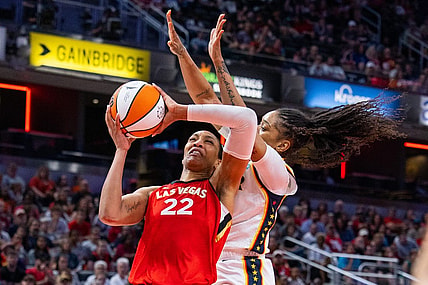 Jun 4, 2023; Indianapolis, Indiana, USA; Las Vegas Aces forward A'ja Wilson (22) shoots the ball while Indiana Fever guard Victoria Vivians (35) defends in the second half at Gainbridge Fieldhouse. Mandatory Credit: Trevor Ruszkowski-USA TODAY Sports