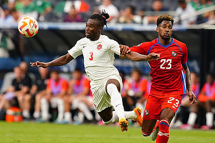 Jun 15, 2023; Las Vegas, Nevada, USA; Panama defender Michael Murillo (23) grabs Canada defender Samuel Adekugbe (3) during the first half at Allegiant Stadium. Mandatory Credit: Lucas Peltier-USA TODAY Sports