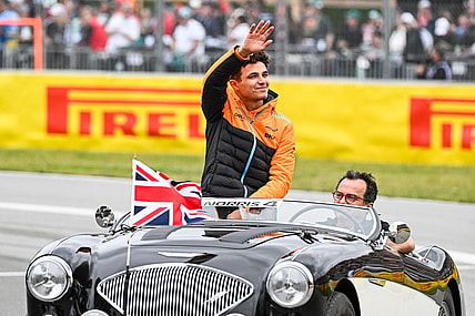 Jun 18, 2023; Montreal, Quebec, CAN; McLaren driver Lando Norris (GBR) parades and salutes the crowd before the Canadian Grand Prix at Circuit Gilles Villeneuve. Mandatory Credit: David Kirouac-USA TODAY Sports