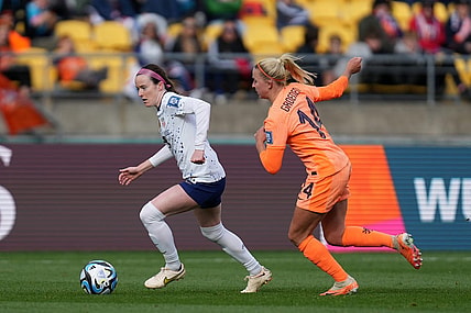 Jul 27, 2023; Wellington, NZL; United States midfielder Rose Lavelle (16) kicks the ball past Netherlands midfielder Jackie Groenen (14) during the second half in a group stage match for the 2023 FIFA Women's World Cup at Wellington Regional Stadium. Mandatory Credit: Jenna Watson-USA TODAY Sports