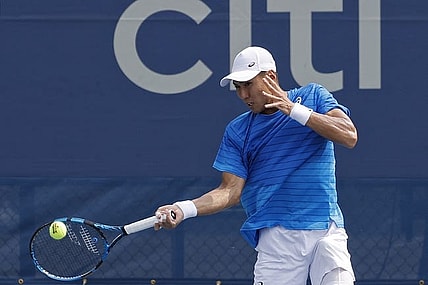 Aug 2, 2023; Washington, D.C., USA; Yosuke Watanuki (JPN) hits a forehand against Felix Auger-Aliassime (CAN) (not pictured) on day five of the Mubadala Citi DC Open at Fitzgerald Tennis Stadium. Mandatory Credit: Geoff Burke-USA TODAY Sports