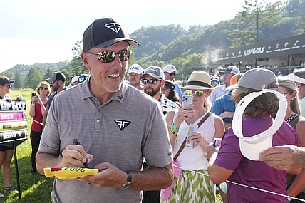 Aug 4, 2023; White Sulphur Springs, West Virginia, USA; Phil Mickelson signs autographs after the first round of the LIV Golf event at The Old White Course. Mandatory Credit: Bob Donnan-USA TODAY Sports