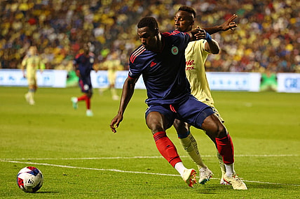 Aug 4, 2023; Bridgeview, IL, USA; Chicago Fire defender Carlos Teran (4) kicks the ball past Club America forward Julian Quinones (33) during the second half at SeatGeek Stadium. Mandatory Credit: Mike Dinovo-USA TODAY Sports