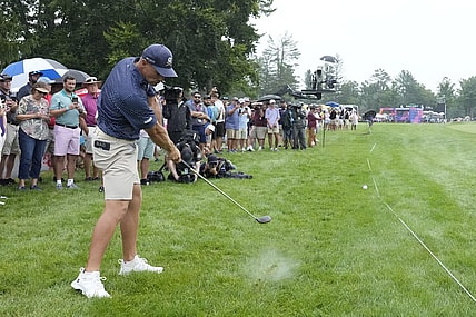 Aug 6, 2023; White Sulphur Springs, West Virginia, USA; Bryson DeChambeau hits his approach shot from the rough on 17 during the final round of the LIV Golf event at The Old White Course. Mandatory Credit: Bob Donnan-USA TODAY Sports