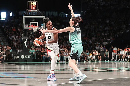 Aug 6, 2023; Brooklyn, New York, USA; Las Vegas Aces guard Chelsea Gray (12) is guarded by New York Liberty forward Breanna Stewart (30) in the third quarter at Barclays Center. Mandatory Credit: Wendell Cruz-USA TODAY Sports