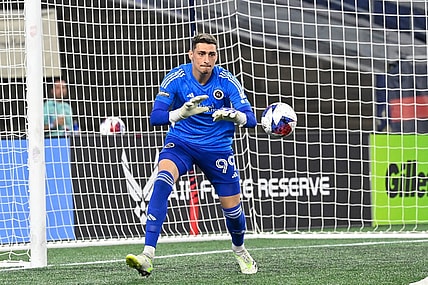 Aug 7, 2023; Foxborough, MA, USA; New England Revolution goalkeeper Djordje Petrovic (99) grabs the ball during the second half against the Queretaro FC at Gillette Stadium. Mandatory Credit: Eric Canha-USA TODAY Sports