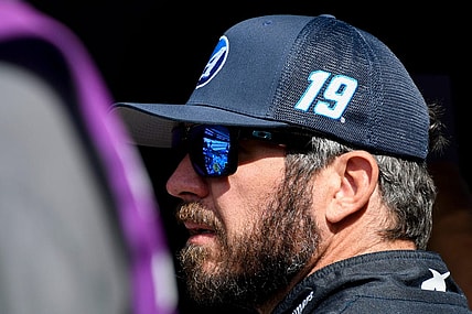 NASCAR Cup Series driver Martin Truex Jr. (19) stands by his car Saturday, Aug. 12, 2023, during practice for the NASCAR Cup Series Verizon 200 at Indianapolis Motor Speedway.
