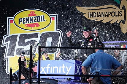 NASCAR Xfinity Series driver Ty Gibbs (19) celebrates on the victory podium Saturday, Aug. 12, 2023, following the NASCAR Xfinity Series Pennzoil 150 at Indianapolis Motor Speedway.