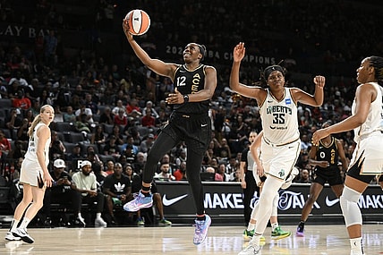 Aug 15, 2023; Las Vegas, Nevada, USA; Las Vegas Aces guard Chelsea Gray (12) drives to the basket against the New York Liberty in the second quarter at Michelob Ultra Arena. Mandatory Credit: Candice Ward-USA TODAY Sports