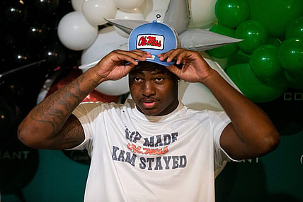 Kamarion Franklin, the No. 1 recruit in Mississippi, puts on an Ole Miss hat as he announces his commitment to Ole Miss football while wearing a shirt that says       Sip Made Kam Stayed    with the Ole Miss logo at Lake Cormorant High School in Lake Cormorant, Miss, on Saturday, August 19, 2023.