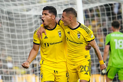 Aug 20, 2023; Columbus, Ohio, USA; Columbus Crew forward Cucho Hernandez (9) celebrates scoring a penalty kick goal with midfielder Alexandru Matan (20) behind FC Cincinnati goalkeeper Roman Celentano (18) during the first half of the MLS soccer match at Lower.com Field.