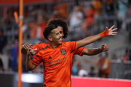 Aug 20, 2023; Houston, Texas, USA; Houston Dynamo midfielder Amine Bassi (8) celebrates after scoring a goal with teammate during the first half at Shell Energy Stadium. Mandatory Credit: Thomas Shea-USA TODAY Sports