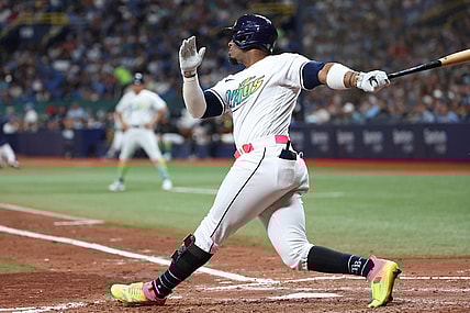Aug 25, 2023; St. Petersburg, Florida, USA; Tampa Bay Rays first baseman Yandy Diaz (2) hits a home run against the New York Yankees during the sixth inning at Tropicana Field. Mandatory Credit: Kim Klement Neitzel-USA TODAY Sports