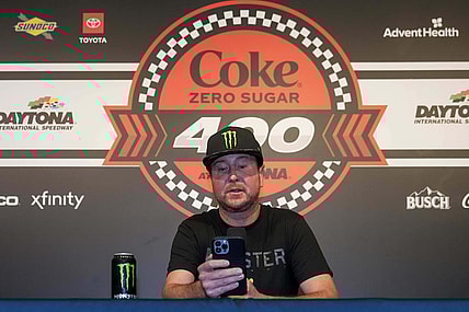 Aug 26, 2023; Daytona Beach, Florida, USA;  Kurt Busch reads from a prepared statement announcing his retirement prior to the Coke Zero Sugar 400 at Daytona International Speedway. Mandatory Credit: David Yeazell-USA TODAY Sports