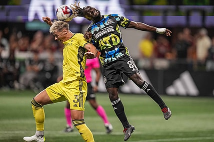 Aug 26, 2023; Atlanta, Georgia, USA; Nashville SC defender Lukas MacNaughton (3) and Atlanta United midfielder Tristan Muyumba (8) battle for the ball during the first half at Mercedes-Benz Stadium. Mandatory Credit: Dale Zanine-USA TODAY Sports