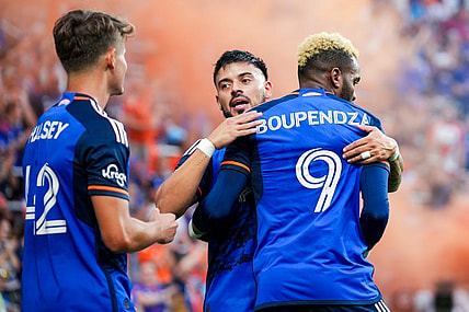 Aug 26, 2023; Cincinnati, Ohio, USA;  FC Cincinnati forward Aaron Boupendza (9) celebrates with midfielder Junior Moreno (93) after scoring a goal against New York City FC in the first half at TQL Stadium. Mandatory Credit: Aaron Doster-USA TODAY Sports