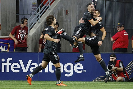 Aug 26, 2023; Sandy, Utah, USA; Houston Dynamo defender Daniel Steres (5), right, is congratulated by midfielder Artur (6) after his first half goal at America First Field. Mandatory Credit: Jeff Swinger-USA TODAY Sports