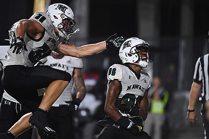 Aug 26, 2023; Nashville, Tennessee, USA; Hawaii Warriors wide receiver Pofele Ashlock (86) celebrates with running back Landon Sims (30) after a touchdown during the second half against the Vanderbilt Commodores at FirstBank Stadium. Mandatory Credit: Christopher Hanewinckel-USA TODAY Sports