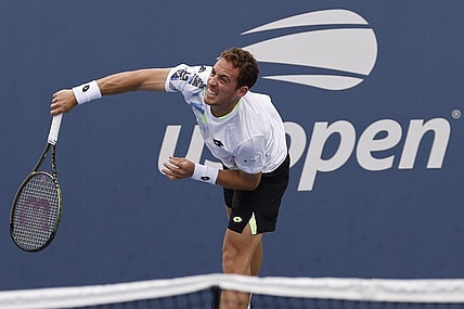 Aug 28, 2023; Flushing, NY, USA; Roberto Carballes Baena of Spain serves against Hulger Rune of Denmark (not pictured) on day one of the 2023 US Open at the Billie Jean King National Tennis Center. Mandatory Credit: Geoff Burke-USA TODAY Sports