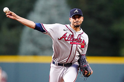Aug 29, 2023; Denver, Colorado, USA; Atlanta Braves starting pitcher Charlie Morton (50) delivers a pitch in the first inning against the Colorado Rockies at Coors Field. Mandatory Credit: Ron Chenoy-USA TODAY Sports