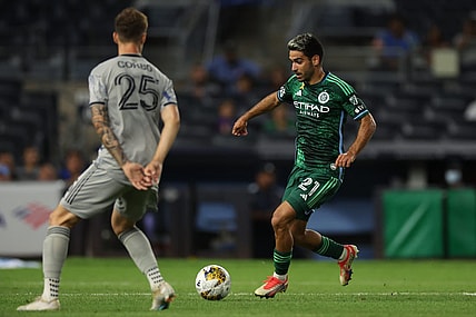 Aug 30, 2023; New York, New York, USA; New York City forward Andres Jasson (21) runs with the ball against CF Montreal defender Gabriele Corbo (25) during the first half at Yankee Stadium. Mandatory Credit: Vincent Carchietta-USA TODAY Sports