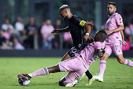 Aug 30, 2023; Fort Lauderdale, Florida, USA; Inter Miami defender Kamal Miller (31) slide tackles Nashville SC midfielder Hany Mukhtar (10) during the second half at DRV PNK Stadium. Mandatory Credit: Rich Storry-USA TODAY Sports