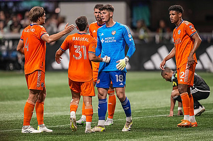 Aug 30, 2023; Atlanta, Georgia, USA; FC Cincinnati players react with goalkeeper Roman Celentano (18) after defeating Atlanta United at Mercedes-Benz Stadium. Mandatory Credit: Dale Zanine-USA TODAY Sports