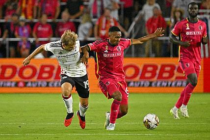 Aug 30, 2023; St. Louis, Missouri, USA; FC Dallas midfielder Paxton Pomykal (19) battles for the ball against St. Louis CITY SC midfielder Njabulo Blom (6) during the first half at CITYPARK. Mandatory Credit: Scott Rovak-USA TODAY Sports