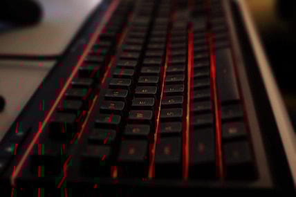 A custom gaming keyboard backlit with red LED lights waits for tactile input before Manual took on Boone County in a Rocket League match, which was streamed on YouTube on Thursday, March 5, 2020.