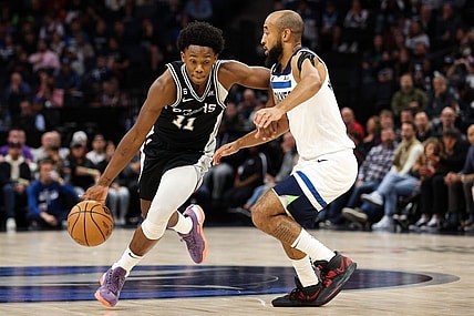 Oct 24, 2022; Minneapolis, Minnesota, USA; San Antonio Spurs guard Joshua Primo (11) dribbles while Minnesota Timberwolves guard Jordan McLaughlin (6) defends during the first quarter at Target Center. Mandatory Credit: Matt Krohn-USA TODAY Sports