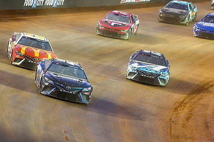 Apr 9, 2023; Bristol, Tennessee, USA; NASCAR Cup Series driver Tyler Reddick (45) leads a pack of cars at the Bristol Motor Speedway Dirt Course. Mandatory Credit: Randy Sartin-USA TODAY Sports