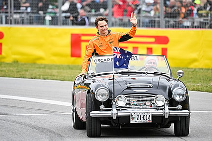 Jun 18, 2023; Montreal, Quebec, CAN; McLaren driver Oscar Piastri (AUS) parades and salutes the crowd before the Canadian Grand Prix at Circuit Gilles Villeneuve. Mandatory Credit: David Kirouac-USA TODAY Sports