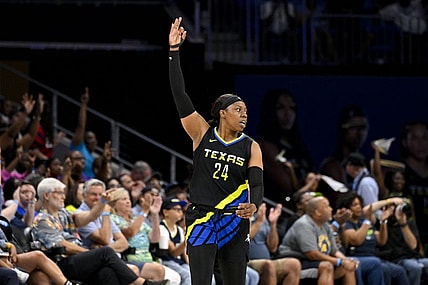 Jul 22, 2023; Arlington, Texas, USA; Dallas Wings guard Arike Ogunbowale (24) celebrates during the second half against the Los Angeles Sparks at College Park Center. Mandatory Credit: Jerome Miron-USA TODAY Sports