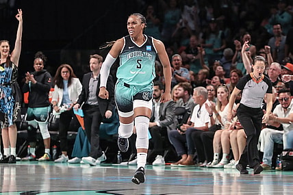 Aug 6, 2023; Brooklyn, New York, USA;  New York Liberty forward Kayla Thornton (5) celebrates after making a three point shot in the third quarter against the Las Vegas Aces at Barclays Center. Mandatory Credit: Wendell Cruz-USA TODAY Sports
