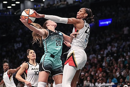 Aug 6, 2023; Brooklyn, New York, USA;  Las Vegas Aces forward A'ja Wilson (22) blocks a shot taken by New York Liberty guard Sabrina Ionescu (20) in the first quarter at Barclays Center. Mandatory Credit: Wendell Cruz-USA TODAY Sports