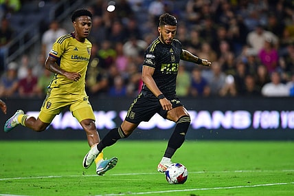 Aug 8, 2023; Los Angeles, CA, USA; Los Angeles FC forward Denis Bouanga (99) scores a goal against Real Salt Lake during the second half at BMO Stadium. Mandatory Credit: Gary A. Vasquez-USA TODAY Sports