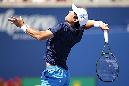 Aug 11, 2023; Toronto, Ontario, Canada; Mackenzie McDonald (USA) overhands a ball to Alejandro Davidovich Fokina (not pictured) at Sobeys Stadium. Mandatory Credit: John E. Sokolowski-USA TODAY Sports