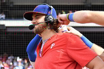 Aug 27, 2023; Philadelphia, Pennsylvania, USA; Philadelphia Phillies starting pitcher Aaron Nola (27) has water poured down his back by teammates after win against the St. Louis Cardinals at Citizens Bank Park. Mandatory Credit: Eric Hartline-USA TODAY Sports