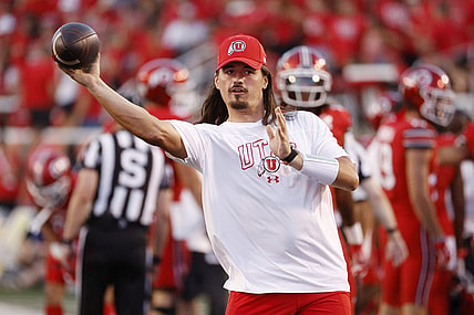 Aug 31, 2023; Salt Lake City, Utah, USA; Utah Utes quarterback Cameron Rising (7), out with an injury warms his quarterback up at halftime against the Florida Gators at Rice-Eccles Stadium. Mandatory Credit: Jeff Swinger-USA TODAY Sports