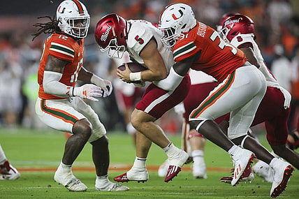 Sep 1, 2023; Miami Gardens, Florida, USA; Miami Hurricanes linebacker Wesley Bissainthe (31) sacks Miami Redhawks quarterback Brett Gabbert (5) during the second quarter at Hard Rock Stadium. Mandatory Credit: Sam Navarro-USA TODAY Sports