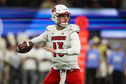 Sep 1, 2023; Atlanta, Georgia, USA; Louisville Cardinals quarterback Jack Plummer (13) looks to throw against the Georgia Tech Yellow Jackets in the second quarter at Mercedes-Benz Stadium. Mandatory Credit: Brett Davis-USA TODAY Sports