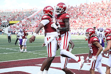 Sep 2, 2023; Little Rock, Arkansas, USA; Arkansas Razorbacks quarterback KJ Jefferson (1) and wide receiver Andrew Armstrong (2) celebrate after a touchdown against the Western Carolina Catamounts at War Memorial Stadium. Arkansas won 56-13. Mandatory Credit: Nelson Chenault-USA TODAY Sports
