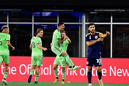 Sep 2, 2023; Foxborough, Massachusetts, USA;  Austin FC midfielder Emiliano Rigoni (7) celebrates his goal by jumping to the arms of midfielder Jon Gallagher (17) during the first half at Gillette Stadium. Mandatory Credit: Eric Canha-USA TODAY Sports