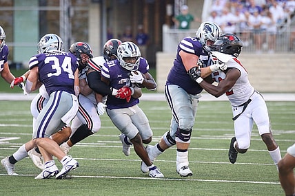 Sep 2, 2023; Manhattan, Kansas, USA; Kansas State Wildcats running back DJ Giddens (31) is tacked by Southeast Missouri State Redhawks defensive lineman LaWilliam Holmes (91) and linebacker Jacob Morrissey (44) during the second quarter at Bill Snyder Family Football Stadium. Mandatory Credit: Scott Sewell-USA TODAY Sports