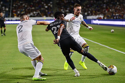 Sep 2, 2023; Carson, California, USA; Houston Dynamo forward Nelson Quinones (21) moves the ball against Los Angeles Galaxy defender Lucas Calegari (2) and midfielder Tyler Boyd (11) during the first half at Dignity Health Sports Park. Mandatory Credit: Gary A. Vasquez-USA TODAY Sports
