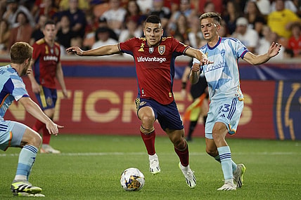 Sep 2, 2023; Sandy, Utah, USA; Real Salt Lake midfielder Braian Ojeda (6) and Colorado Rapids midfielder Cole Bassett (23) battle in the first half at America First Field. Mandatory Credit: Jeff Swinger-USA TODAY Sports