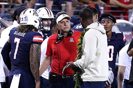 Sep 2, 2023; Tucson, Arizona, USA; Arizona Wildcats head coach Jedd Fisch talks the Arizona Wildcats quarterback Jayden de Laura (7) after an interception during the second half at Arizona Stadium. Mandatory Credit: Zac BonDurant-USA TODAY Sports