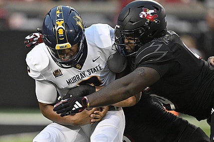 Sep 7, 2023; Louisville, Kentucky, USA; Louisville Cardinals defensive lineman Dezmond Tell (99) sacks Murray State Racers quarterback DJ Williams (2) during the first quarter at L&N Federal Credit Union Stadium. Mandatory Credit: Jamie Rhodes-USA TODAY Sports