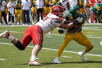 Sep 9, 2023; Waco, Texas, USA; Utah Utes defensive tackle Keanu Tanuvasa (57) tackles Baylor Bears running back Richard Reese (29) during the second half at McLane Stadium. Mandatory Credit: Raymond Carlin III-USA TODAY Sports